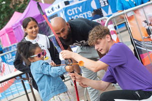 Family playing archery at Sports Fest