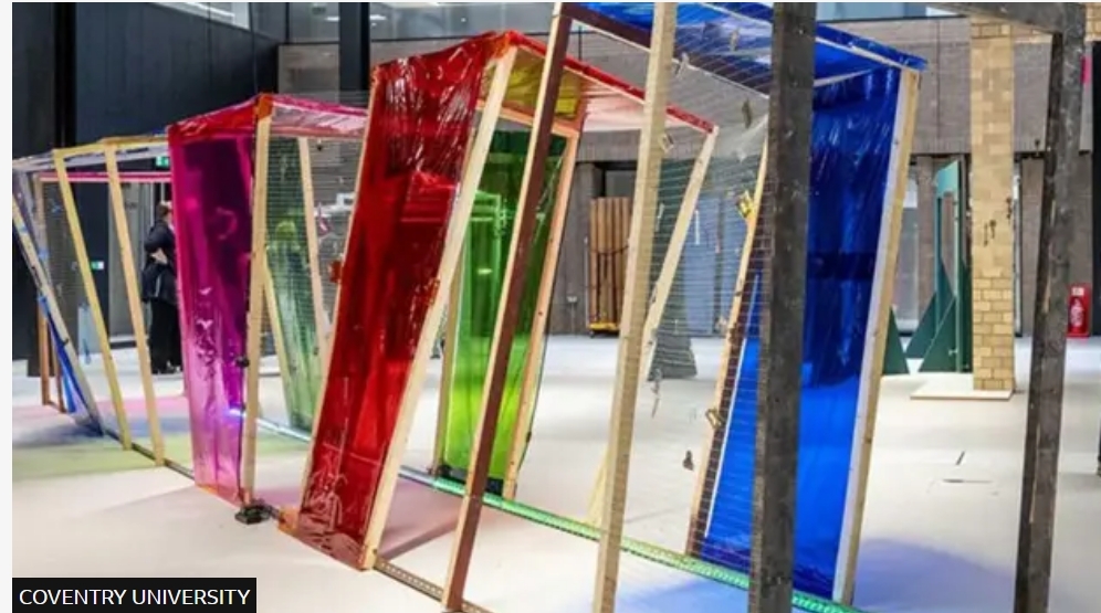 Art sculpture of a walkway made by timber from demolition