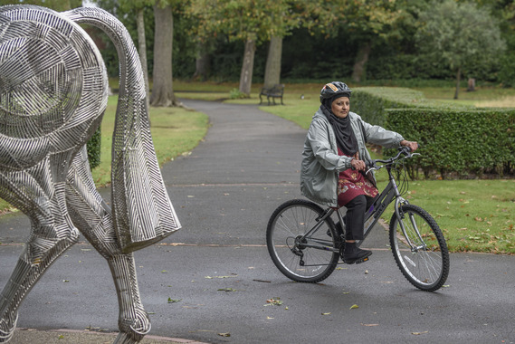 FemaleCyclistParkHijab