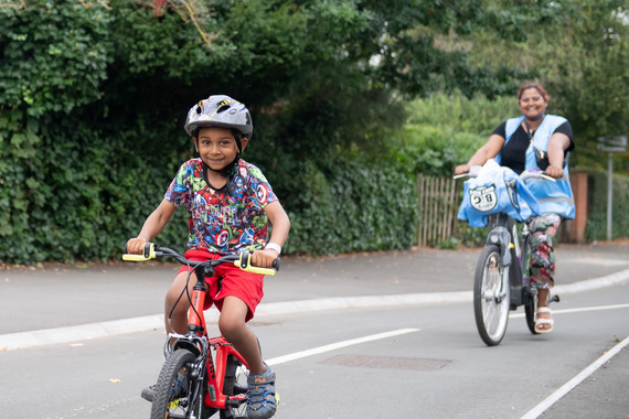 Happy Child Cycling with Mum