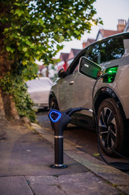 Image of a Trojan Home charging unit linked into the car