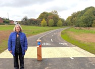 Image of Cllr Hetherton in front of the new segregated cycleway