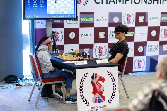 Two people playing chess