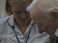 Integrated care nurse with elderly gentleman