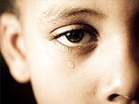 young boy crying