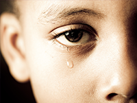 Tear falling from child's eye