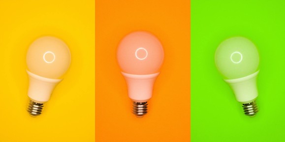 Three lightbulbs on yellow, orange and green backgrounds