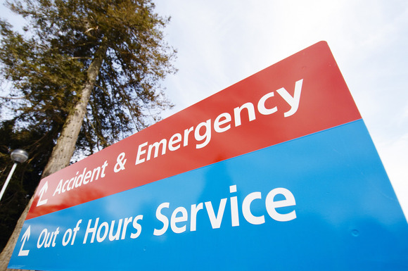 Photograph of a hospital road sign that reads from the top: Accident & Emergency (below) Out of Hours Service