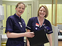 Two smiling nurses