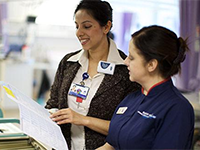 Two medical staff looking at paperwork