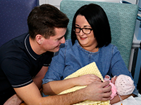 Parents and a new-born baby (Photo by gov.scot, used under a Creative Commons licence)