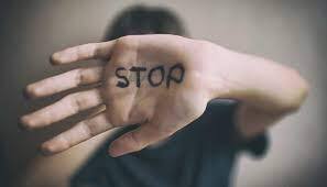 Hand with stop written on (DA)