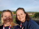 Team members smile into the sunshine for selfie