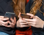 girls holding mobile phones