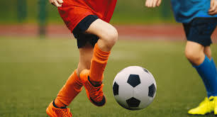 children playing football