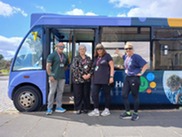 Hub2U team stood in front of bus