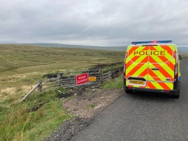 Police vehicle parked up in the rural