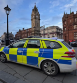 Eden driving op - car infront of town clock