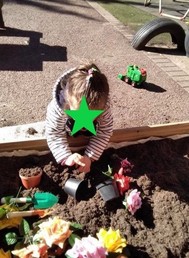 Child playing in soil pit