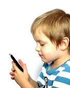 young boy looking at mobile phone