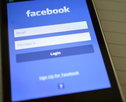 Smart Phone with Facebook Application Loading