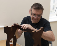 Man repairing wooden furniture