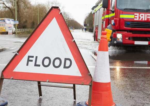flood sign with fire engine stock pic