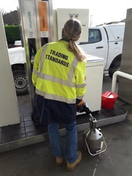 trading standards officer checks petrol pump