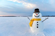 Snowman stood in snow