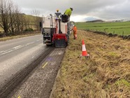 Small scale road resurfacing repairs being carried out along the A515.