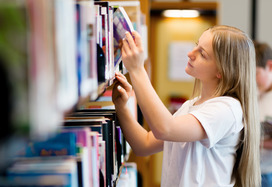 Teenage girl in library