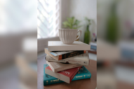 a cup placed on a stack of books