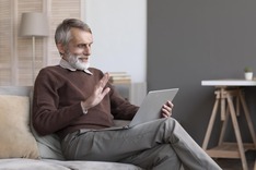 smart home technology laptop senior man