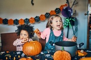 Two children with two pumpkins