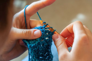 Close up shot of a woman crocheting