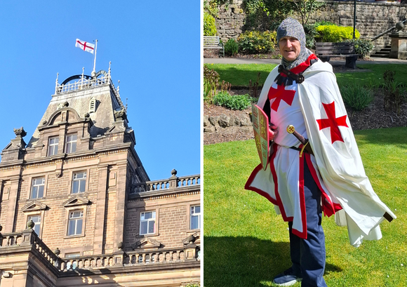 Councillor Alan Graves dressed up for St George's Day with picture of the George Cross flag flying at County Hall