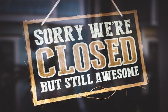 Door sign saying sorry we're closed, but still awesome