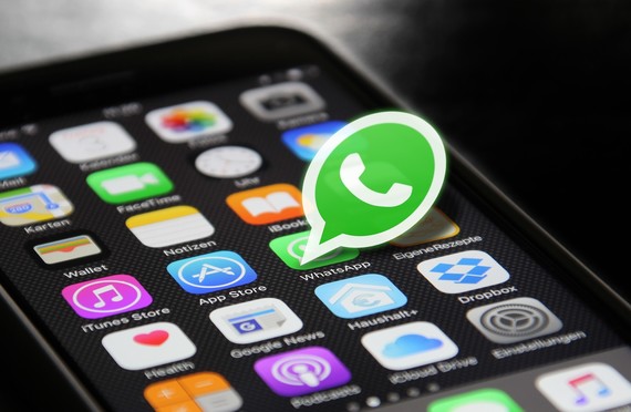 phone with apps and Whatsapp logo 