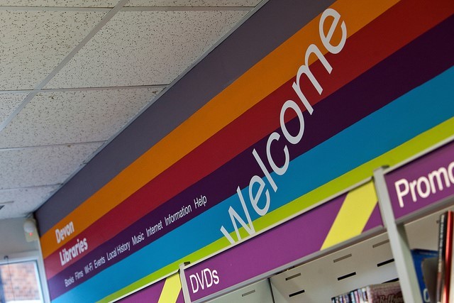 A welcome sign at the entrance into a Devon Library