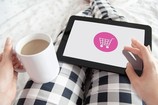 Woman using iPad to shop online