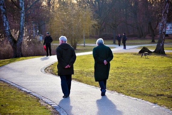 elderly people walking in park