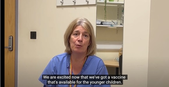 Doctor explaining a vaccine is now available for eligible younger children
