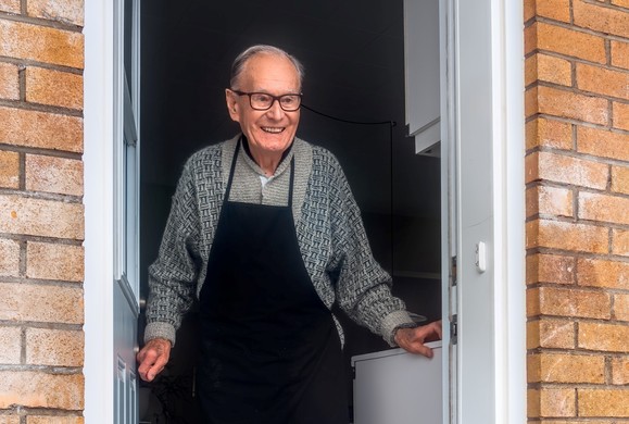 elderly man in doorway