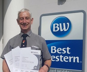 Simon Adams of the Lord Haldon Country Hotel, holding his certificates