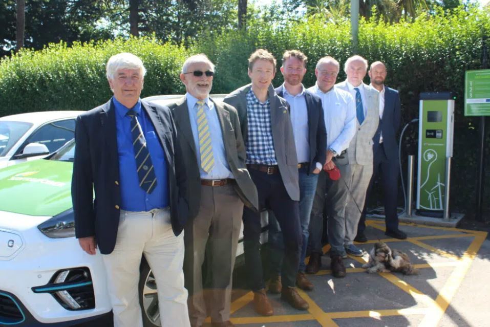 First of 80 new Electric Vehicle charging points ready for use - Council staff and Members stood in the sun by charging point