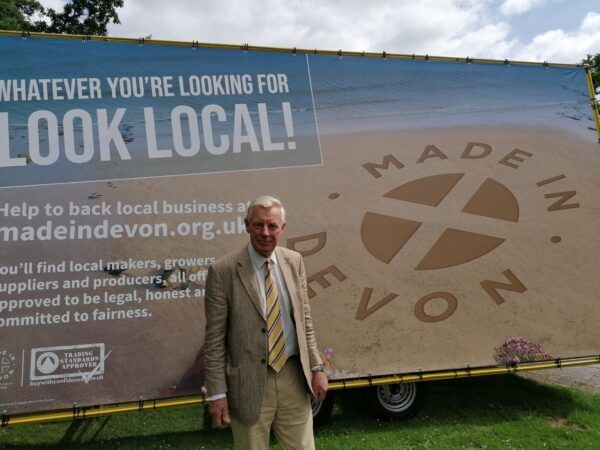Cllr Rufus Gilbert with Made in Devon Billboard