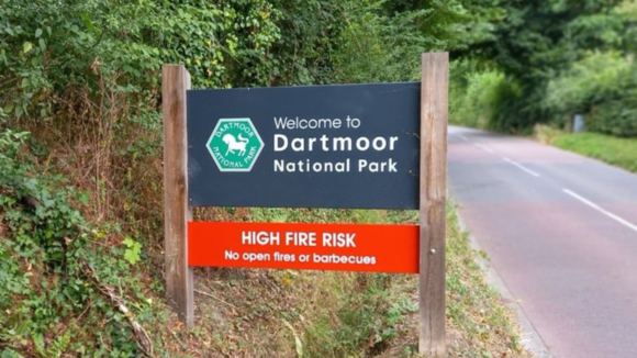 Dartmoor National Park Authority sign welcoming visitors but asking people not to light open fires or barbeques