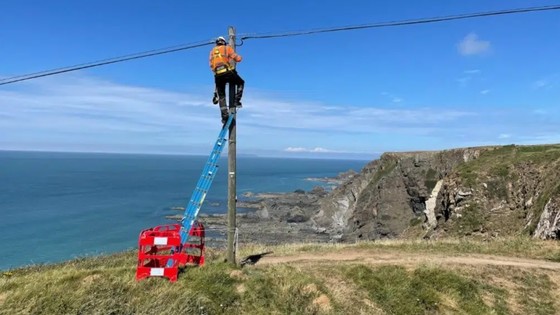 Telephone engineer installing broadband in rural Devon