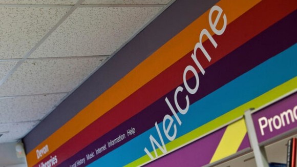 A welcome sign above one of our library doors