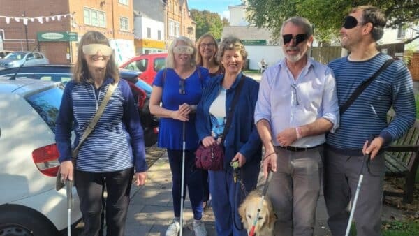 The group setting off on their blindfolded walk along Magdalen Road in Exeter